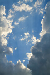 blue sky with white fluffy clouds