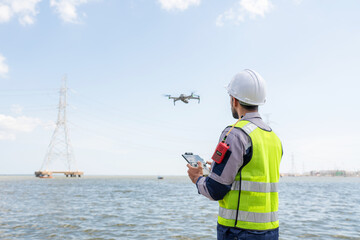 Engineer Specialists Pilot Drone on Construction Site. Architectural Engineer and Safety Engineering Inspector Fly Drone at industrial plant.