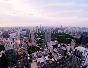 Obraz premium Sunset in megalopolis. Beautiful cityscape with top view on skyscrapers. Bangkok, Thailand.