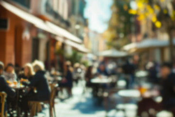 Blurred background of People sitting at tables in outdoor cafe, on bustling street. Relaxed atmosphere, featuring individuals enjoying coffee and casual conversation in lively city environment.