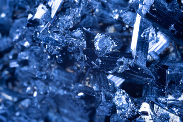 Blue Crystal Mineral Stone. Gems. Mineral crystals in the natural environment. Texture of precious and semiprecious stones. Seamless background with copy space colored shiny surface of precious stones