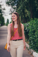 Photo of lovely positive adorable girl wear trendy clothes walk in park summer time weather outdoors