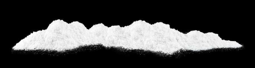 Pile of fluffy white snow isolated on a black background. Sparkling white snow hills. Christmas night.
