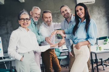 Photo of teamwork startup partners confident posing people show circle comfortable nice creative startup office loft room interior