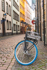 Bicycle with basket on an old narrow European street