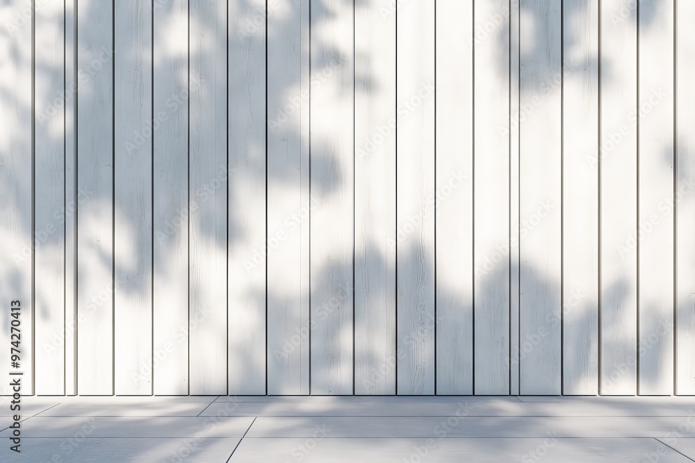 Poster this image features white modern vertical wall panels, where shadows of external objects create a pl
