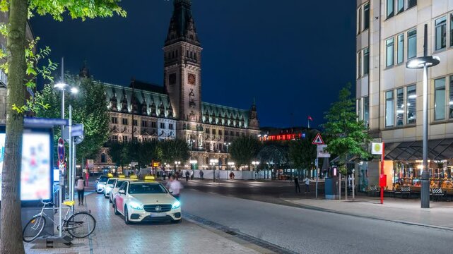 Hamburg, Germany. The central part of Hamburg, Germany Car traffic in front of the Rathaus during the night. Time-lapse 4K, Hamburg town hall