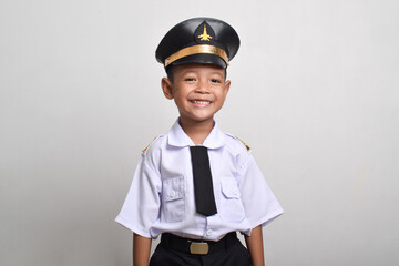 Little Asian boy Airplane pilot isolated on white background. Little boy dreams of becoming an airplane pilot.