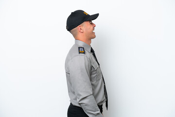 Young caucasian security man isolated on white background laughing in lateral position