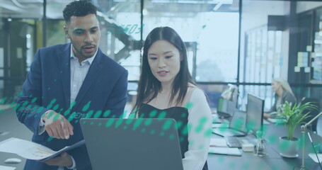 Image of financial data processing over diverse colleagues discussing work in office