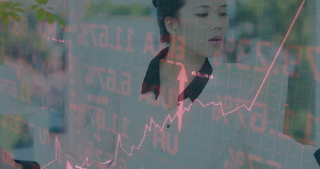Image of financial data processing over asian businesswoman using computer