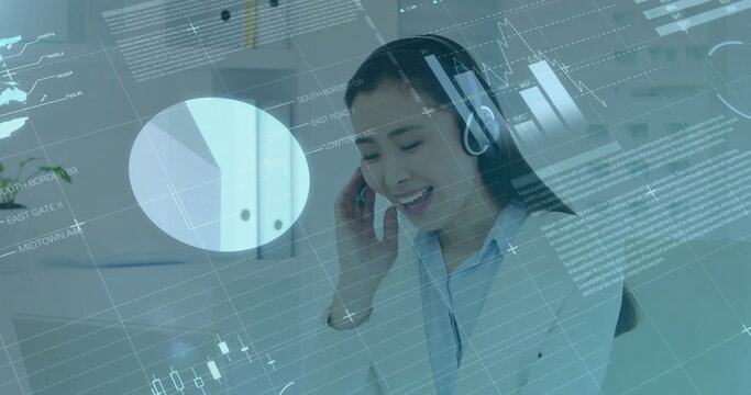 Image of financial data processing over asian businesswoman using phone headset and computer