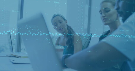 Image of financial data processing over diverse business people using laptop