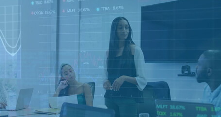 Image of financial data processing over diverse business people in office