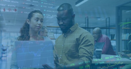 Image of financial data processing over diverse business people using laptop