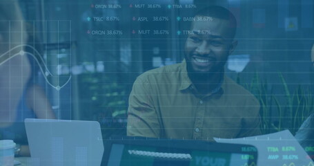 Image of financial data processing over diverse business people using laptop