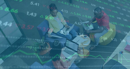 Image of financial data processing over diverse business people in office