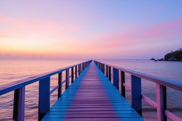 A brightly colored wooden boardwalk stretches over a calm beach