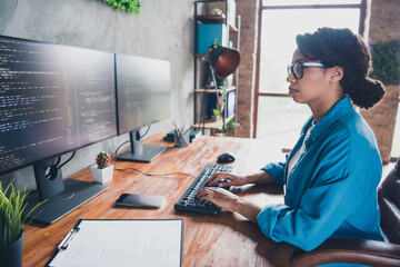 Photo of attractive young woman working monitor coding wear blue shirt modern office programmer...