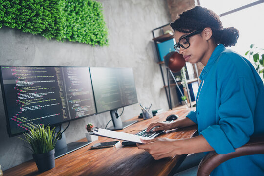 Photo of lovely young lady report documents coding it developer dressed blue shirt comfortable programmer startup office loft room interior