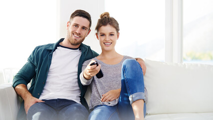 Happy couple, relax and watching tv in home for movie, streaming service and chill. Television, man and woman smile in living room for drama show, film and change channel for series on sofa together