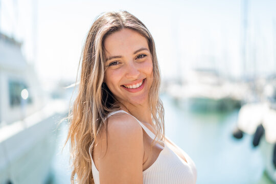 Young pretty woman at outdoors With happy expression