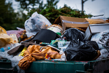 Garbage in a dumpster in the city street 