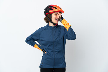 Young English cyclist woman isolated on white background smiling a lot