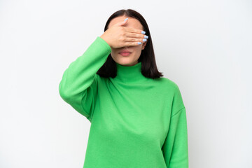 Young caucasian woman isolated on white background covering eyes by hands. Do not want to see...