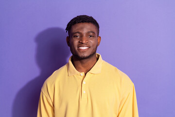Fototapeta premium Photo portrait of pretty young male look camera toothy smile wear trendy yellow outfit isolated on purple color background