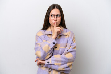 Obraz premium Young girl isolated on white background showing a sign of silence gesture putting finger in mouth