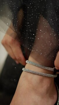 High-heeled shoes with shiny details. Concept of elegance in details