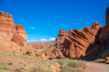 Fototapeta premium Charyn Canyon, Valley of Castles. The excellence of Kazakhstan. Panorama of natural unusual landscape. The red canyon of extraordinary beauty looks like a Martian landscape.
