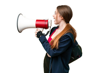 Young sport woman with sport bag over isolated chroma key background shouting through a megaphone