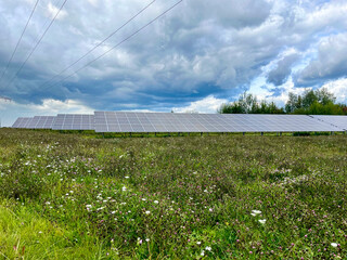 Clean energy against the backdrop of nature - solar panels and ecology