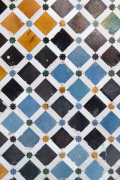 abstract colorful ancient tiles background on wall from Alhambra Castle in Granada, Spain