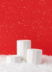 Christmas Product Presentation Scene made with Three Cylinder Podiums on Artificial Snow. Perfect...