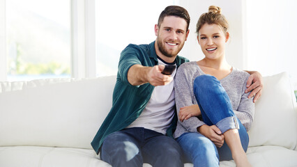 Relax, portrait and happy couple watching tv in home for movie choice, streaming service and chill. Television, man and woman smile in living room for drama show, film and change channel on couch