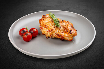 Grilled chicken breast with rosemary and cherry tomatoes