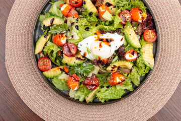 Salmon salad with cream cheese and poached egg