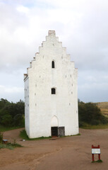 Today only the bell tower remains in Denmark of the old church Buried by the Sand called Den Tilsandede Kirke in Danish language without people