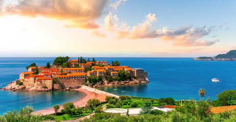 beautiful summer landscape of amazing resort on amazing island with yellow ancient walls and orange tile roofs among sea vawes and nice blue sky on background