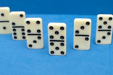 Dominoes bones on blue background	