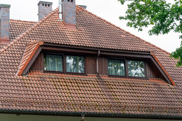 the roof of a house covered with red tiles