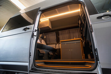 Comfortable interior of a passenger bus with soft seats. The design is made to order. Private covering of cars. Various elements of the bus interior.