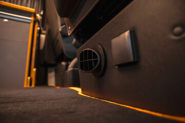 Comfortable interior of a passenger bus with soft seats. The design is made to order. Private...