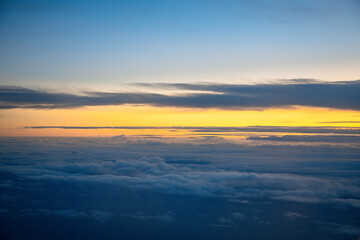 China Shanghai - Sunrise above the clouds from the plane