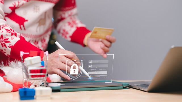 A person in a festive sweater uses a tablet to make a secure online purchase, emphasizing the importance of online security during holiday shopping