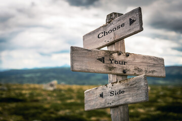 choose your side text quote on wooden directional signpost outdoors in nature