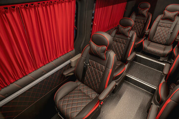 Comfortable interior of a passenger bus with soft seats. The design is made to order. Private covering of cars. Various elements of the bus interior.